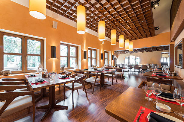 Newly constructed restaurant with wood decor and pendant lights